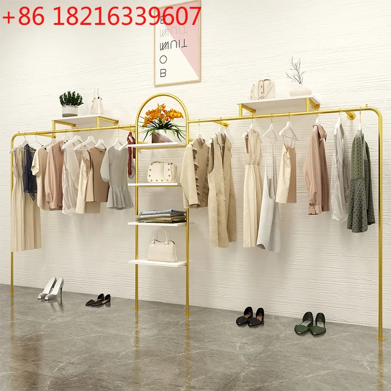 Легкая роскошная золотая витрина для магазина одежды, настенная стойка от пола до потолка, кованая женская одежда
Легкая роскошная золотая витрина для магазина одежды, настенная стойка от пола до потолка, кованая женская одежда