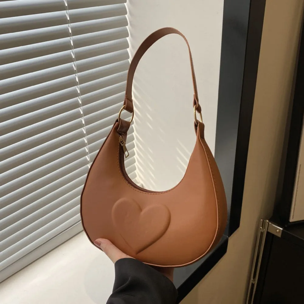 Простая однотонная сумка в форме полумесяца под мышками Love Heart в корейском стиле из искусственной кожи, сумка на плечо, универсальная женская сумка-хобо
Простая однотонная сумка в форме полумесяца под мышками Love Heart в корейском стиле из искусственной кожи, сумка на плечо, универсальная женская сумка-хобо