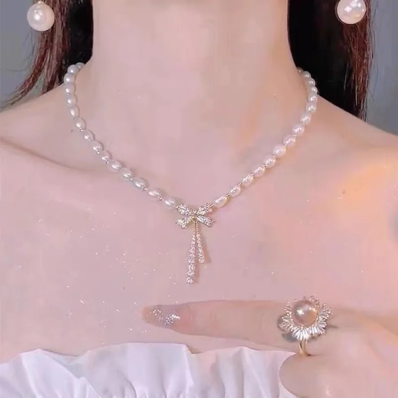 Freshwater Necklace Bow Pendant 6Mm Rice Shape Pearl Choker 
Freshwater Necklace Bow Pendant 6Mm Rice Shape Pearl Choker