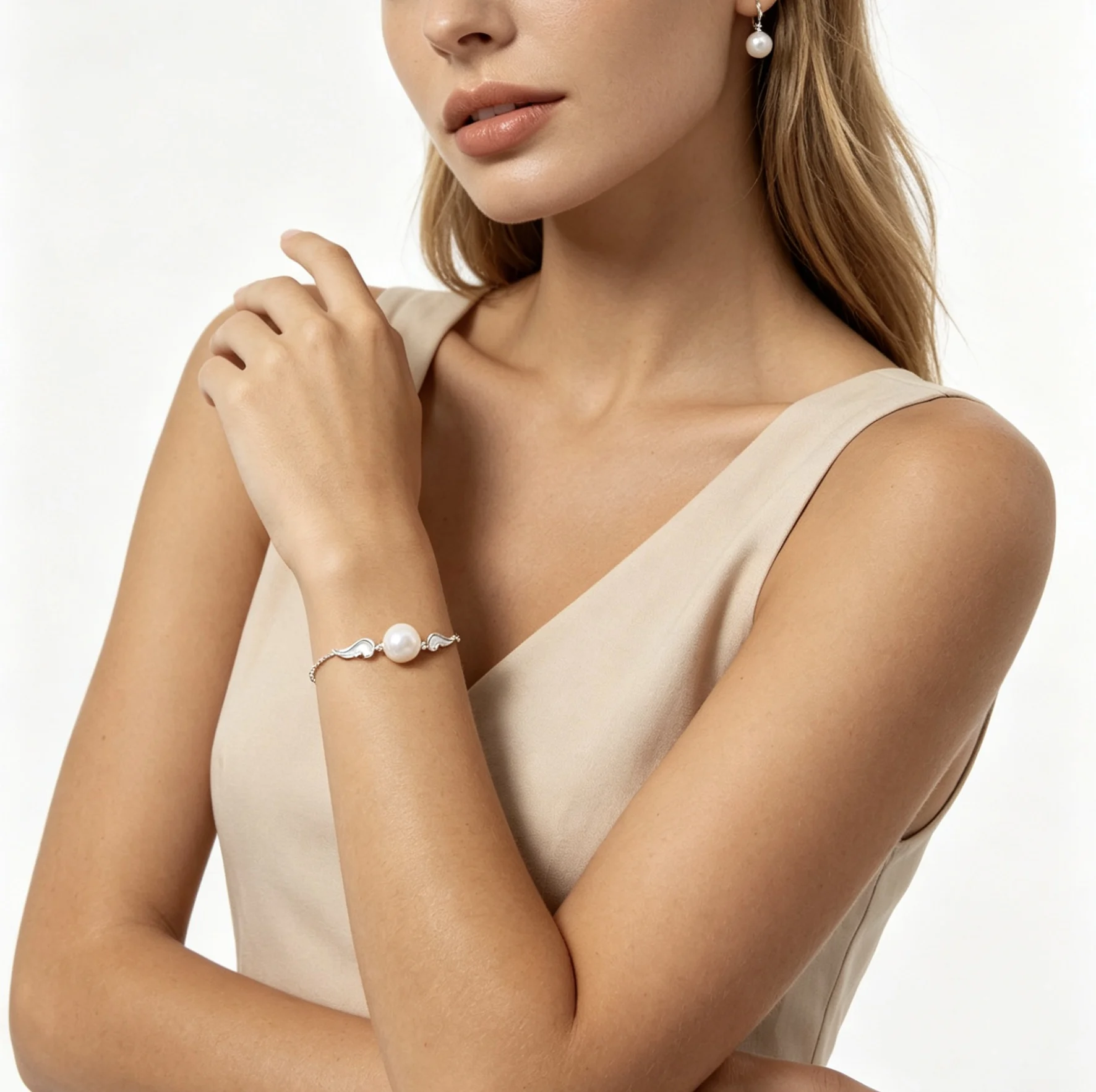 Handcrafted Dainty Pearl Bracelet with Angel Wing Details
Handcrafted Dainty Pearl Bracelet with Angel Wing Details