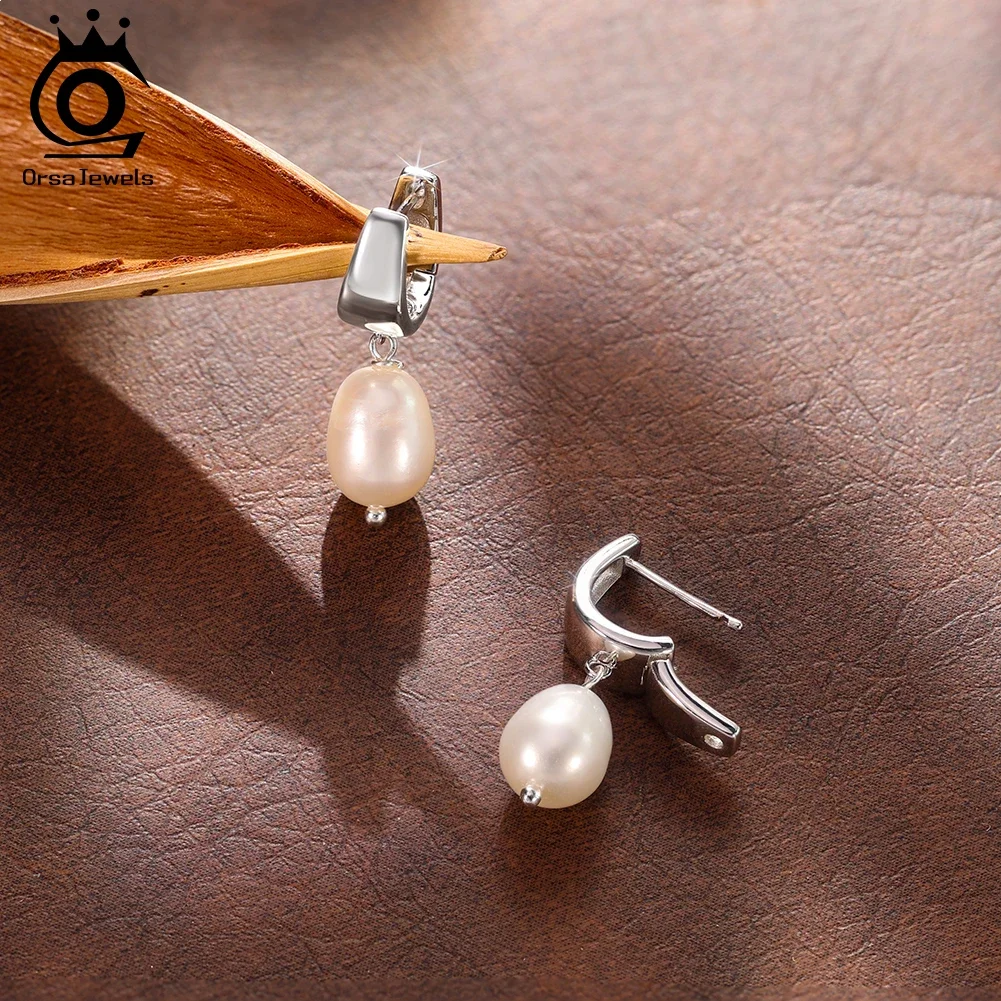 ORSA JEWELS Elegant 14K Gold Genuine 925 Sterling Silver Dangle Pearl Earrings with Handpicked Natural Pearl for Women GPE130
ORSA JEWELS Elegant 14K Gold Genuine 925 Sterling Silver Dangle Pearl Earrings with Handpicked Natural Pearl for Women GPE130