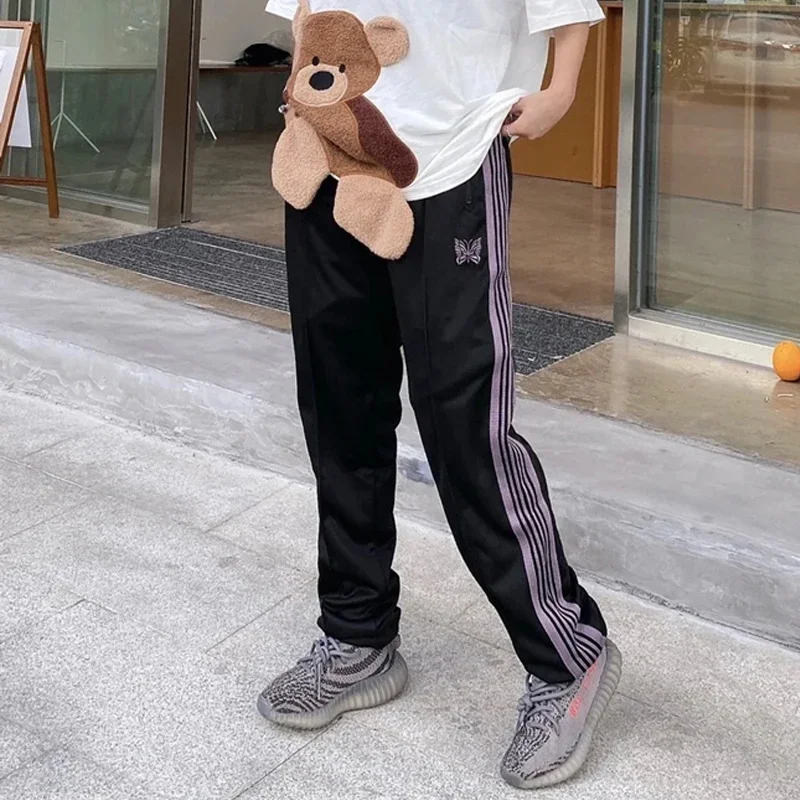 Arrival Webbing Track Stripe Pants Trousers Butterfly Embroidery Oversize Zipper Black Men Women New Street Sweatpants
Arrival Webbing Track Stripe Pants Trousers Butterfly Embroidery Oversize Zipper Black Men Women New Street Sweatpants