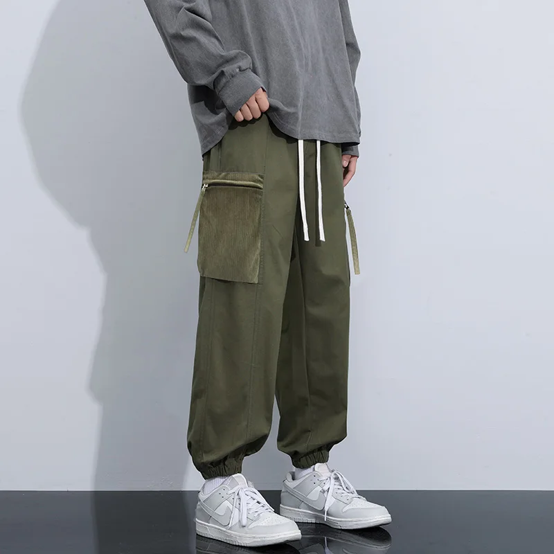 Solid Men Cargo Pants with Big Pockets Korean Loose Sports Casual Pants Male Spring and Autumn Drawstring Ankle-Length Pants
Solid Men Cargo Pants with Big Pockets Korean Loose Sports Casual Pants Male Spring and Autumn Drawstring Ankle-Length Pants