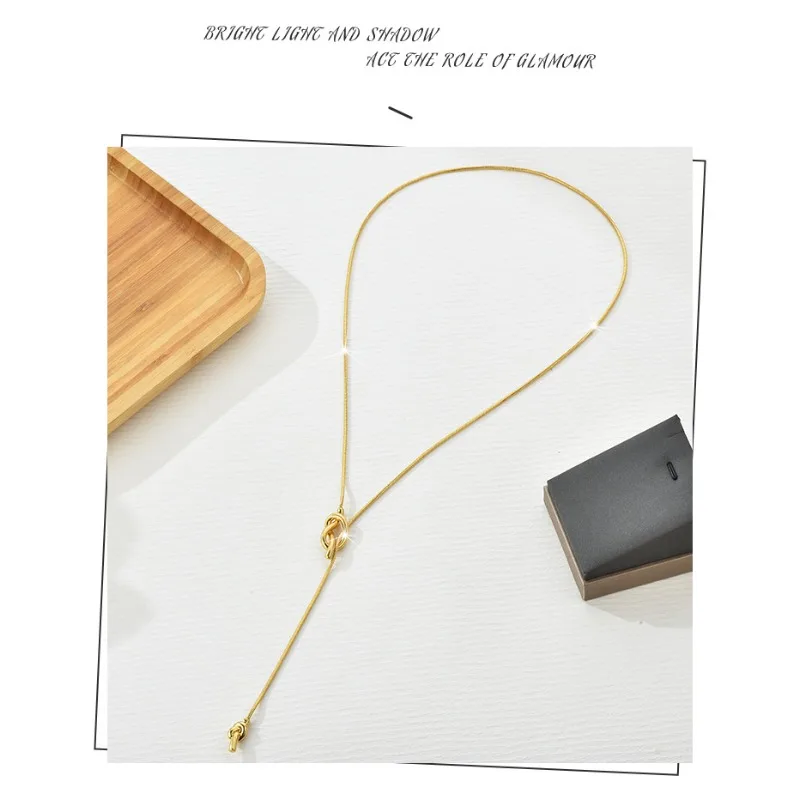 A retro gold long sailor knot multi-functional sweater chain necklace accessory for ladies, a fashionable clothing necklace
A retro gold long sailor knot multi-functional sweater chain necklace accessory for ladies, a fashionable clothing necklace