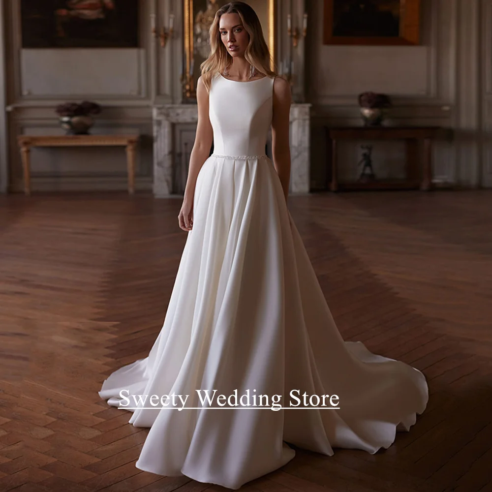 New Arrival Wedding Dress 2026 Customized Scoop Neck Sleeveless Beading Belt A Line Sweep Train Modern Woman Bridal Gown
New Arrival Wedding Dress 2026 Customized Scoop Neck Sleeveless Beading Belt A Line Sweep Train Modern Woman Bridal Gown