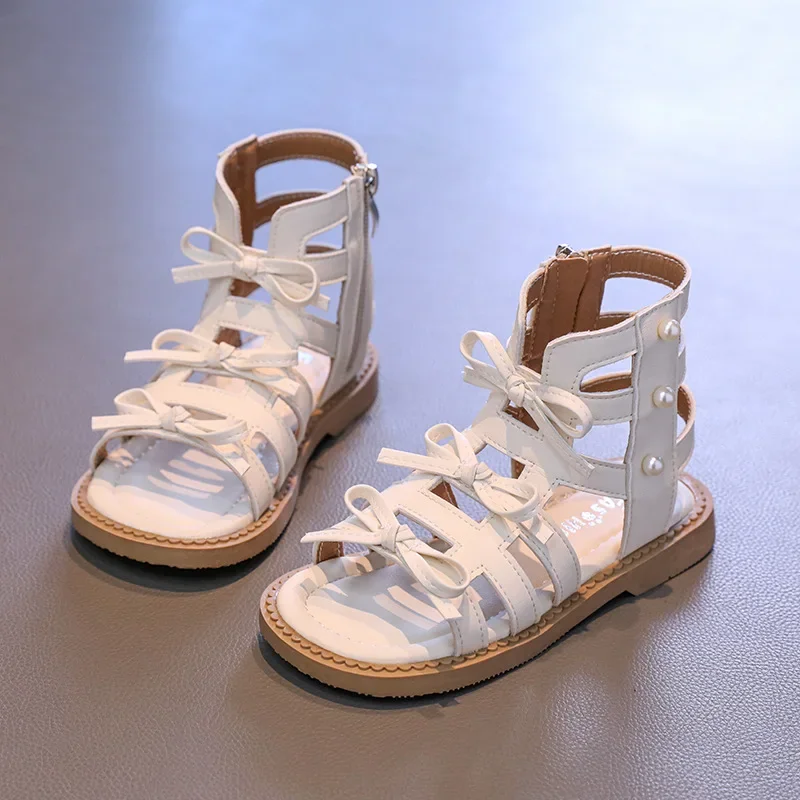 Сандалии для девочек, новинка лета 2024, детские римские сандалии с мягкой подошвой, модная обувь принцессы с бантом и жемчугом для девочек
Сандалии для девочек, новинка лета 2024, детские римские сандалии с мягкой подошвой, модная обувь принцессы с бантом и жемчугом для девочек
