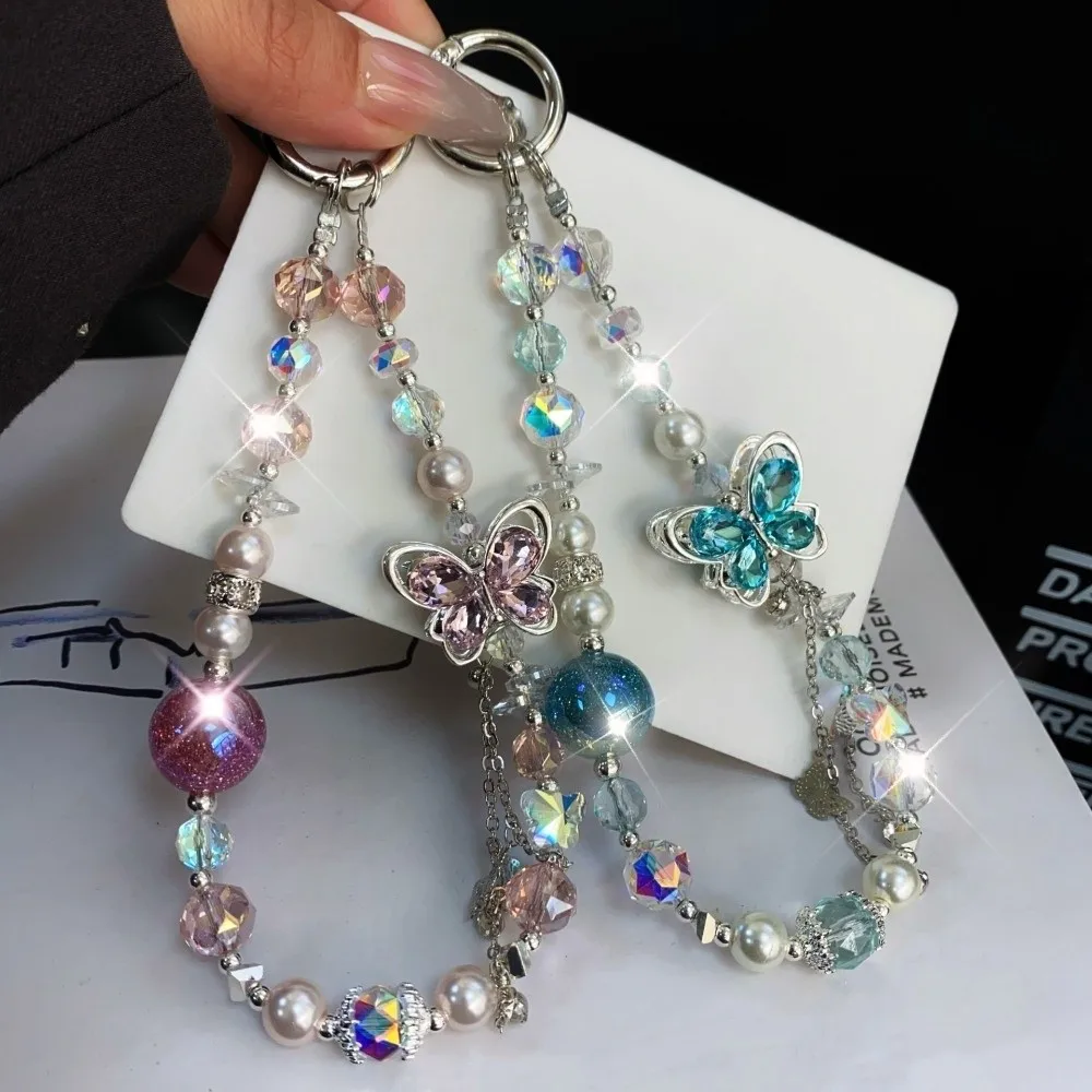 Ремешок для телефона с бабочкой и кристаллами из бисера, жемчужная цепочка для мобильного телефона с защитой от потерь, роскошный сверкающий ремешок для мобильного телефона, аксессуары для чехла для телефона
Ремешок для телефона с бабочкой и кристаллами из бисера, жемчужная цепочка для мобильного телефона с защитой от потерь, роскошный сверкающий ремешок для мобильного телефона, аксессуары для чехла для телефона