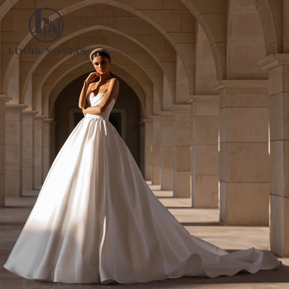 LOUIS NOVIAS Атласные свадебные платья для женщин без бретелек без рукавов со шлейфом трапециевидной формы на шнуровке свадебное платье Robe De Mariage
LOUIS NOVIAS Атласные свадебные платья для женщин без бретелек без рукавов со шлейфом трапециевидной формы на шнуровке свадебное платье Robe De Mariage