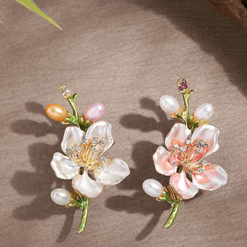 "National trend enamel peach blossom brooch for women, a niche, light luxury and high-end brooch pearl accessory.
"National trend enamel peach blossom brooch for women, a niche, light luxury and high-end brooch pearl accessory.