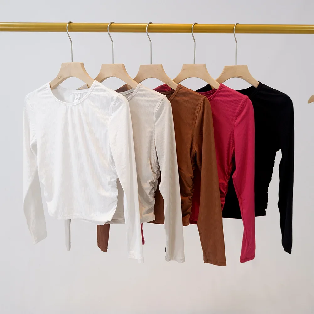 New long sleeved round neck yoga suit ribbed women's base shirt with four-way elastic slimming and slimming sports T-shirt
New long sleeved round neck yoga suit ribbed women's base shirt with four-way elastic slimming and slimming sports T-shirt