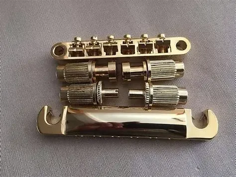 1 Set Gold Tune-O-Matic SG Electric Guitar Bridge And Taiiece Gold
1 Set Gold Tune-O-Matic SG Electric Guitar Bridge And Taiiece Gold