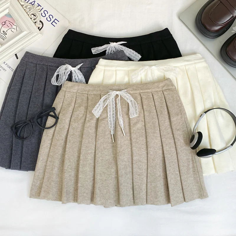 Модная простая однотонная вязаная плиссированная юбка с завязками на талии для женщин, осень-зима
Модная простая однотонная вязаная плиссированная юбка с завязками на талии для женщин, осень-зима