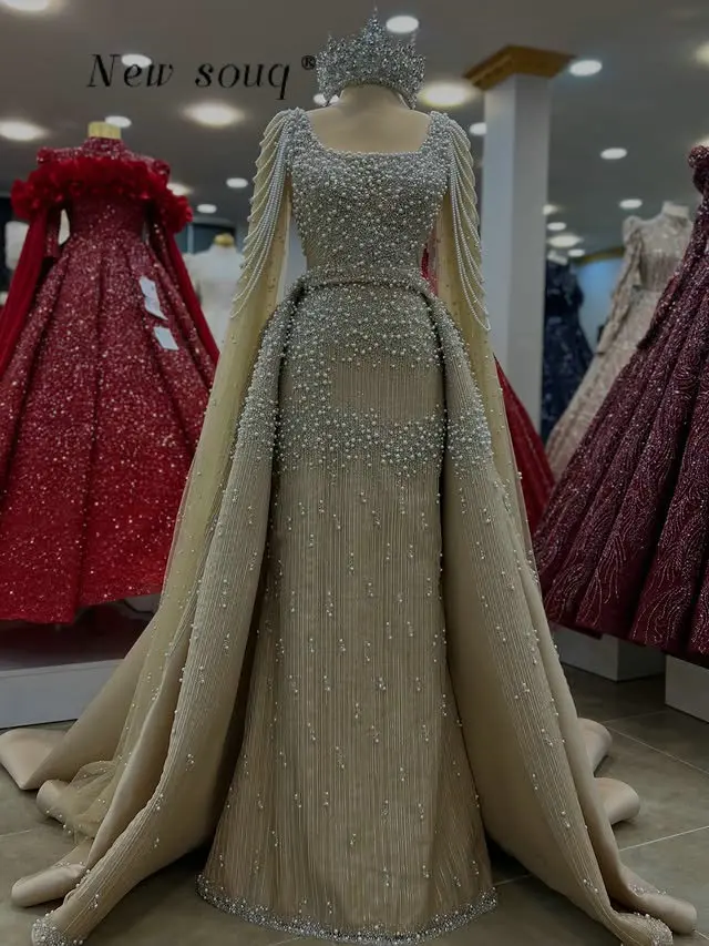 Потрясающие вечерние платья из Дубая с жемчугом и бисером, индивидуальный пошив, квадратный вырез, арабские мусульманские свадебные и праздничные платья с накидками
Потрясающие вечерние платья из Дубая с жемчугом и бисером, индивидуальный пошив, квадратный вырез, арабские мусульманские свадебные и праздничные платья с накидками