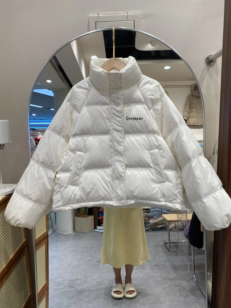 2023 Women Winter Solid Casual Coat Lady Stand Collar Loose Oversize Warm Streetwears Korean Fashion White Duck Down Jackets
2023 Women Winter Solid Casual Coat Lady Stand Collar Loose Oversize Warm Streetwears Korean Fashion White Duck Down Jackets