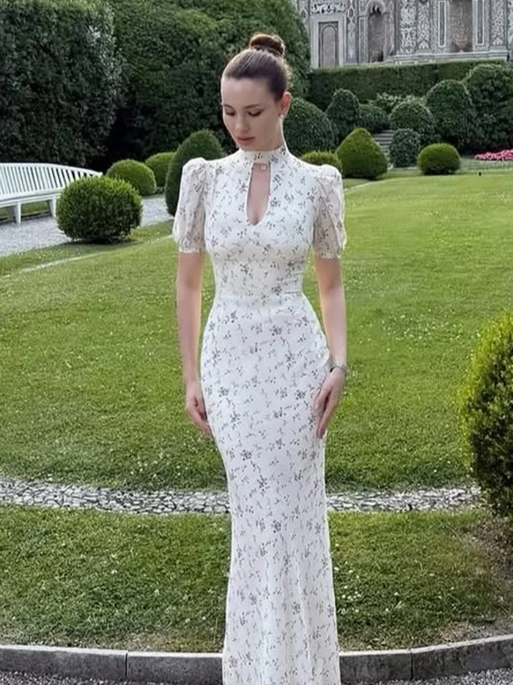 Elegant Floral Print Maxi Dress Women Stand Collar High Waist Hollow Out Puff Sleeve Slim Gown 2026 New Lady Holiday Party Wear
Elegant Floral Print Maxi Dress Women Stand Collar High Waist Hollow Out Puff Sleeve Slim Gown 2026 New Lady Holiday Party Wear