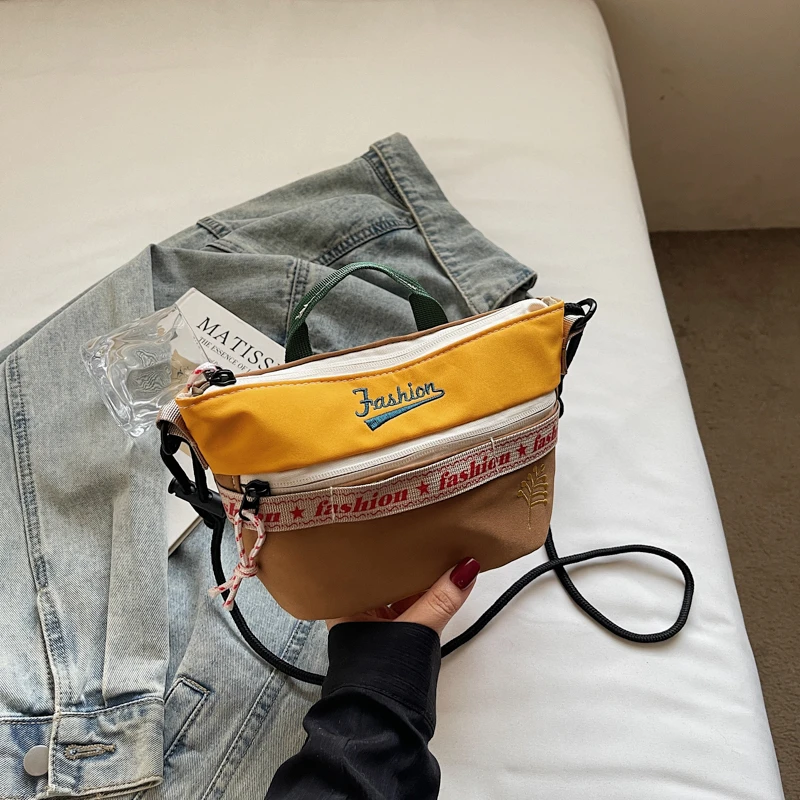 Повседневная сумка через плечо, новая женская модная универсальная сумка из нейлона, сумка-пельмень, легкая, прочная и стильная.
Повседневная сумка через плечо, новая женская модная универсальная сумка из нейлона, сумка-пельмень, легкая, прочная и стильная.