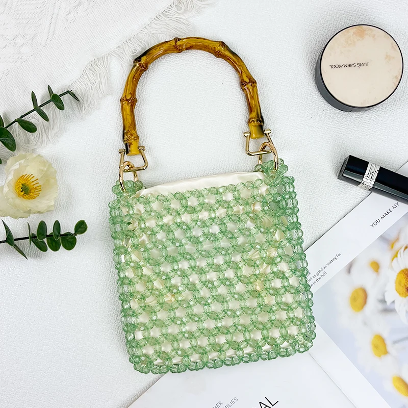 New niche handmade woven bead acrylic bucket bag with hollowed out crystal green dual ring versatile handbag
New niche handmade woven bead acrylic bucket bag with hollowed out crystal green dual ring versatile handbag