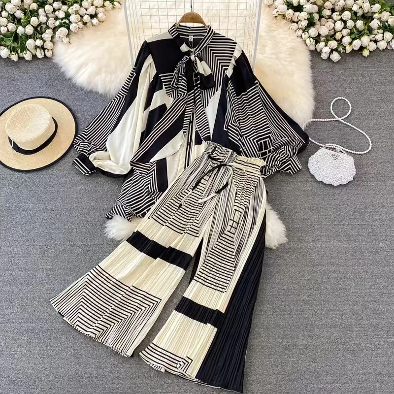 Новинка 2025, осенняя женская свободная рубашка в стиле ретро с геометрическим принтом и бантом, рубашка нестандартной формы, комплект из двух предметов + плиссированные широкие брюки, модный комплект
Новинка 2025, осенняя женская свободная рубашка в стиле ретро с геометрическим принтом и бантом, рубашка нестандартной формы, комплект из двух предметов + плиссированные широкие брюки, модный комплект