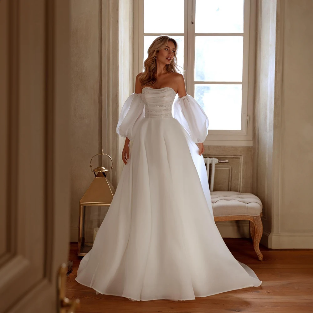 Customized Sweetheart Beaded Pearls Wedding Dress A-line Court Tulle Wedding Gowns with Removable Ruff Sleeve robes de mariée
Customized Sweetheart Beaded Pearls Wedding Dress A-line Court Tulle Wedding Gowns with Removable Ruff Sleeve robes de mariée