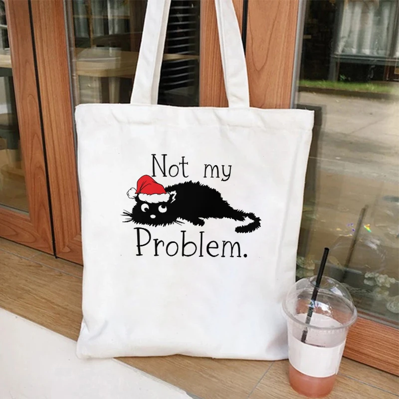 25. Новая сумка с милым принтом черного кота, сумка с верхней ручкой для женщин, портативная сумка для покупок, простая, не моя проблема с принтом
25. Новая сумка с милым принтом черного кота, сумка с верхней ручкой для женщин, портативная сумка для покупок, простая, не моя проблема с принтом