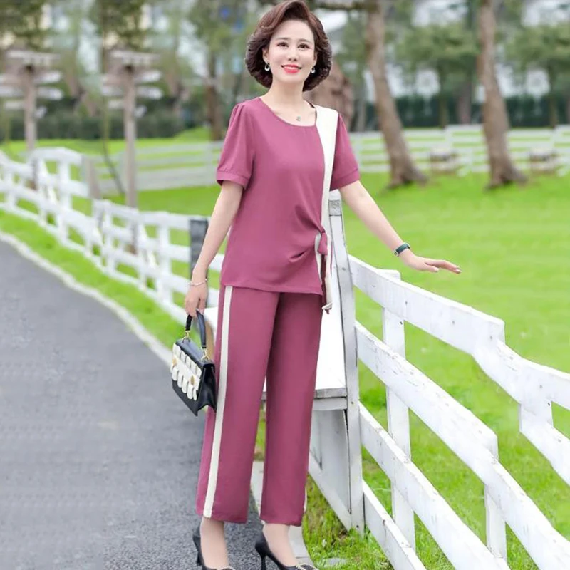 Summer Tracksuit Women Short Sleeve Top And Wide Leg Pants Suits Casual Two Piece Set Womens Outfits 5XL
Summer Tracksuit Women Short Sleeve Top And Wide Leg Pants Suits Casual Two Piece Set Womens Outfits 5XL