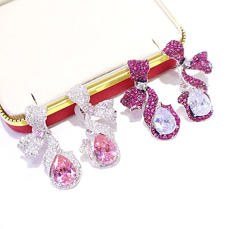 ZOCA Luxury Custom Quality Zircon 925 Sterling Silver Bow Earrings Ice Flower Cut Main Stone Gift Best Friend Fine Jewelry
ZOCA Luxury Custom Quality Zircon 925 Sterling Silver Bow Earrings Ice Flower Cut Main Stone Gift Best Friend Fine Jewelry