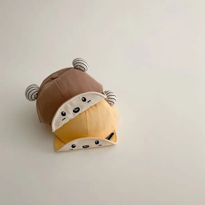 Весенне-летняя милая детская шляпа с утиным языком, солнцезащитный козырек, хлопковая бейсболка с милыми ушками из мультфильма для мальчиков и девочек, уличная шапка для новорожденных
Весенне-летняя милая детская шляпа с утиным языком, солнцезащитный козырек, хлопковая бейсболка с милыми ушками из мультфильма для мальчиков и девочек, уличная шапка для новорожденных