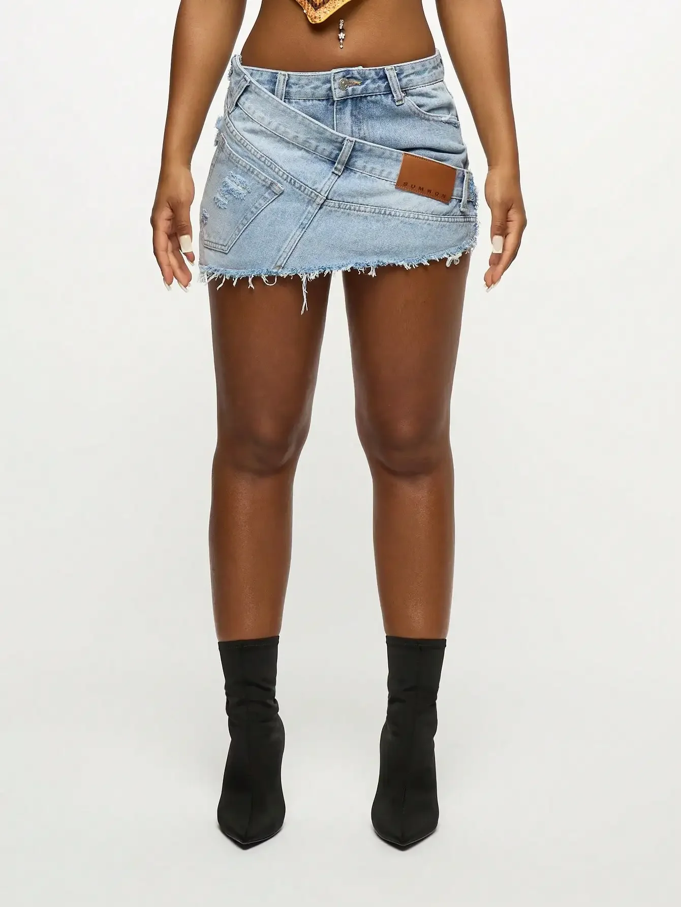 Women's High Waist Asymmetrical Distressed Denim Mini Skirt with Raw Hem
Women's High Waist Asymmetrical Distressed Denim Mini Skirt with Raw Hem