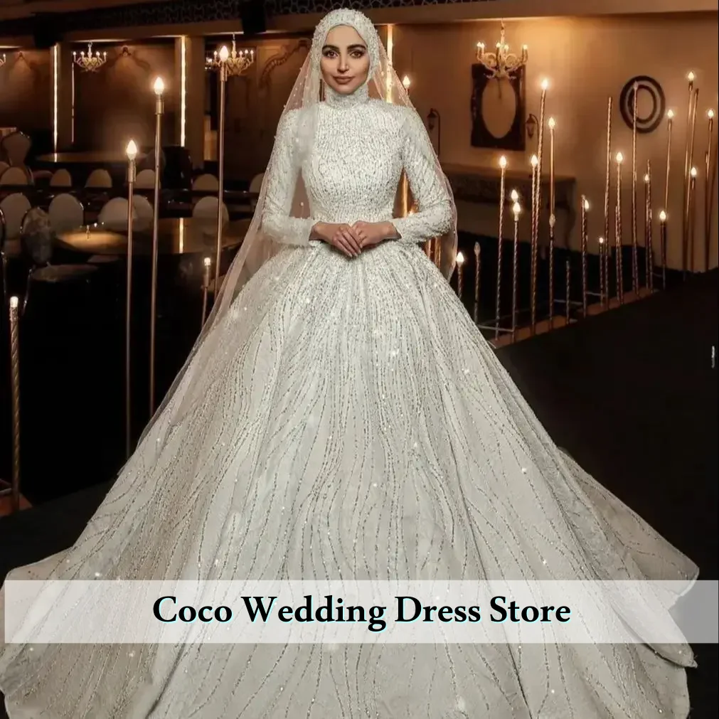 Изысканные свадебные платья с высоким воротником, длинными рукавами и блестками для невесты, мусульманские свадебные платья, свадебное платье Vestido De Novia.
Изысканные свадебные платья с высоким воротником, длинными рукавами и блестками для невесты, мусульманские свадебные платья, свадебное платье Vestido De Novia.