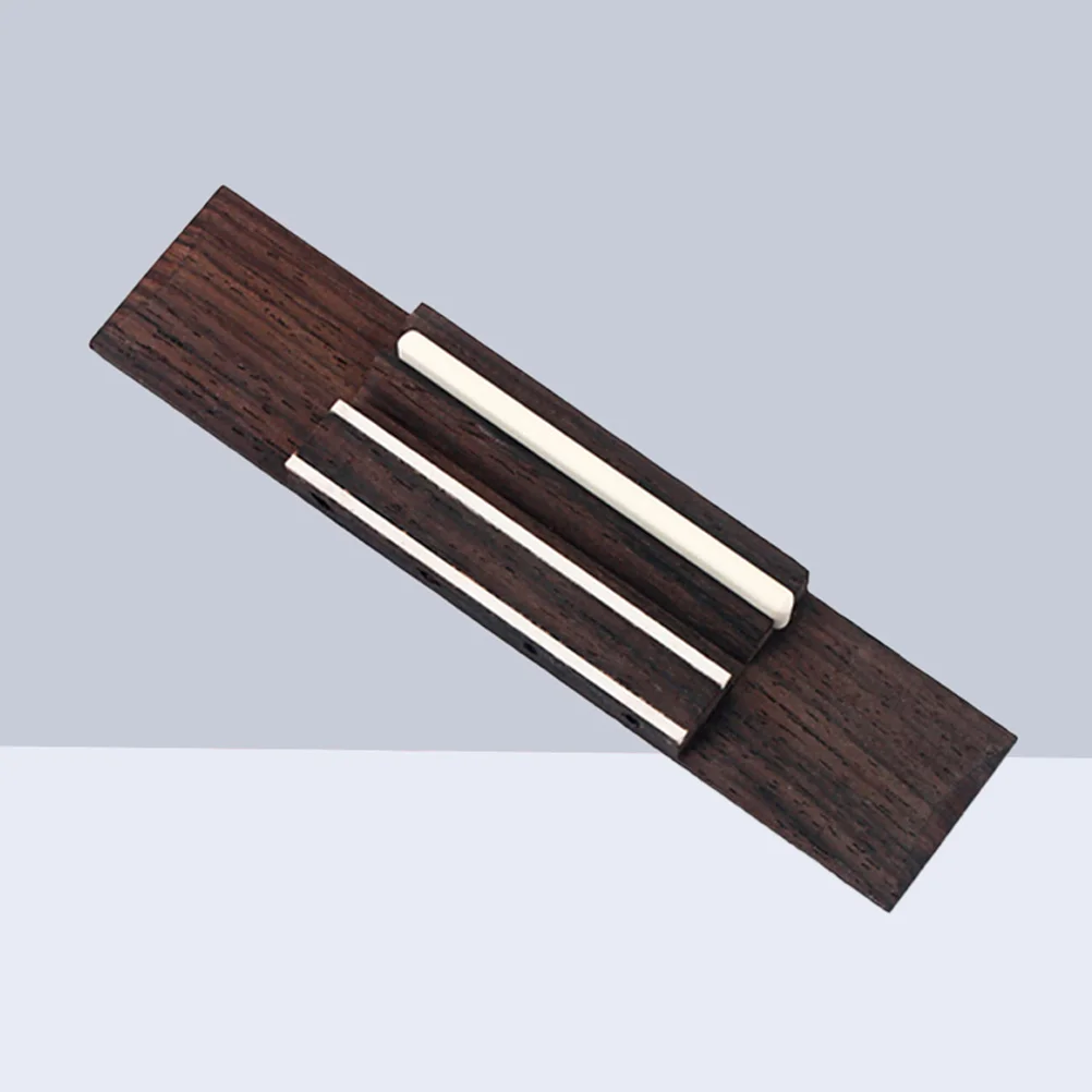 4-String Rosewood Ukulele Bridge Saddle Pre-Drilled for Easy Installation Classic Look Replacement Part for Musicians
4-String Rosewood Ukulele Bridge Saddle Pre-Drilled for Easy Installation Classic Look Replacement Part for Musicians