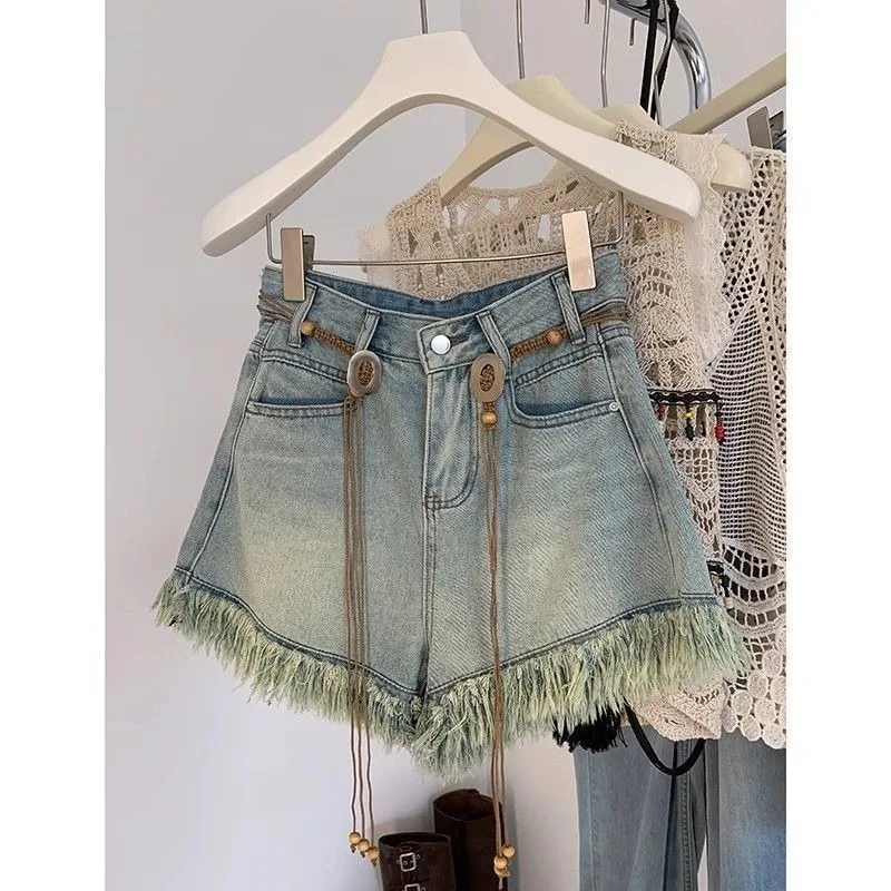 This Summer's New Style of Fringed Denim Shorts Women Features Stylish Design and High-waisted Wide-leg Hot Pants with Waistband
This Summer's New Style of Fringed Denim Shorts Women Features Stylish Design and High-waisted Wide-leg Hot Pants with Waistband