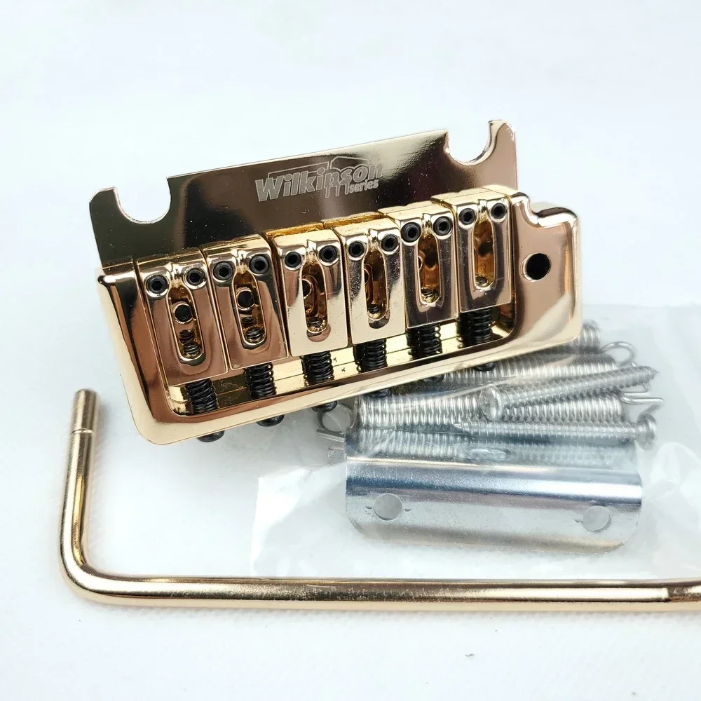 Wilkinson WOV08 Электрогитара Tremolo System Bridge 2-точечная золотая двойная качалка для гитары ST и Suhr
Wilkinson WOV08 Электрогитара Tremolo System Bridge 2-точечная золотая двойная качалка для гитары ST и Suhr