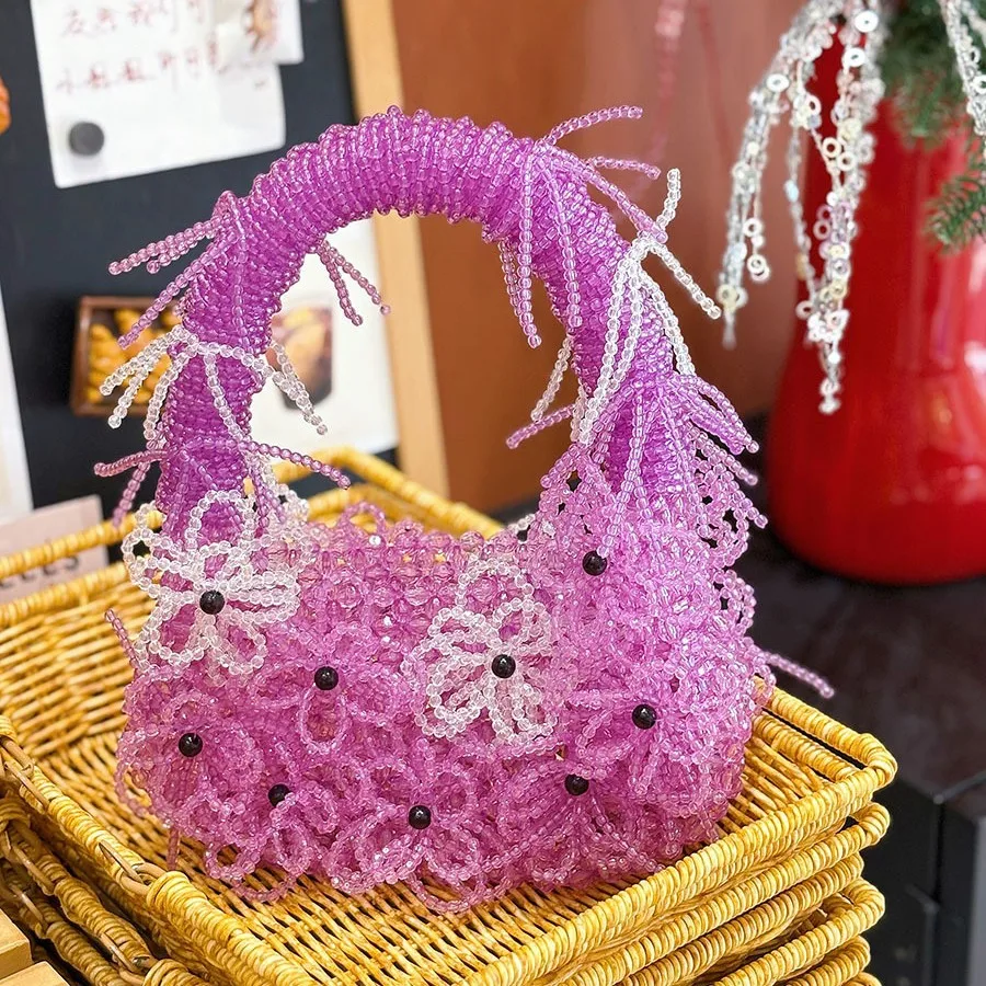 Плетеная сумка ручной работы с цветком из бисера, творческая личность, повседневная сумка для смены помады
Плетеная сумка ручной работы с цветком из бисера, творческая личность, повседневная сумка для смены помады