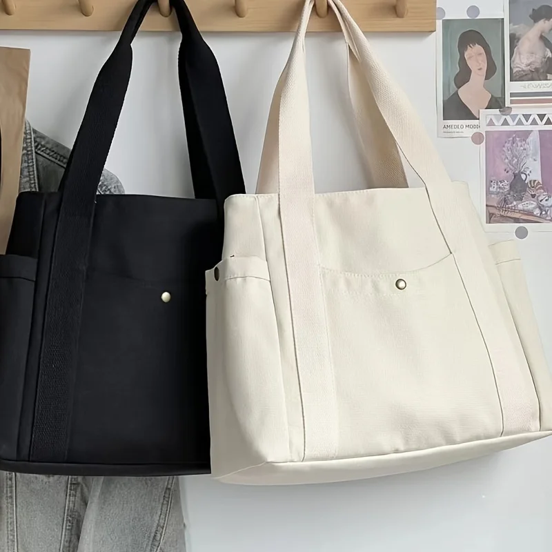 Spacious Canvas Tote Bag with Organizational Pockets - Durable Multipurpose Shoulder Handbag for Work, School & Shopping
Spacious Canvas Tote Bag with Organizational Pockets - Durable Multipurpose Shoulder Handbag for Work, School & Shopping
