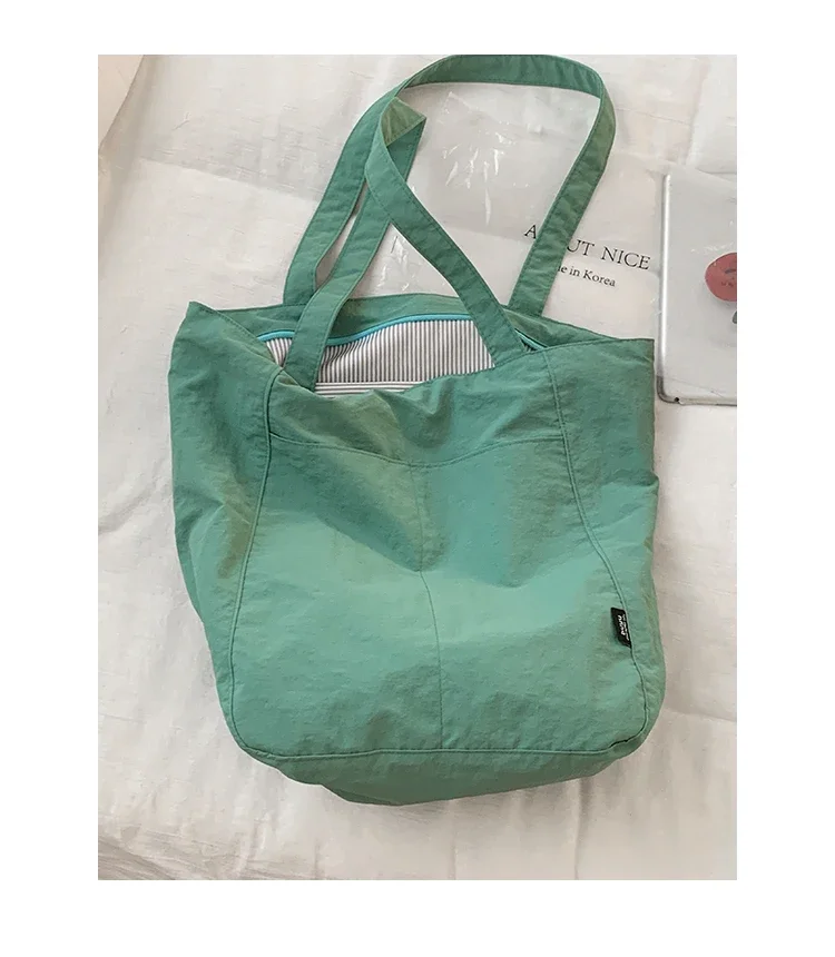 2025 New Fashion College Sail Cloth Bags Korean Versatile Large Capacity Shoulder Tote Bag for Women
2025 New Fashion College Sail Cloth Bags Korean Versatile Large Capacity Shoulder Tote Bag for Women