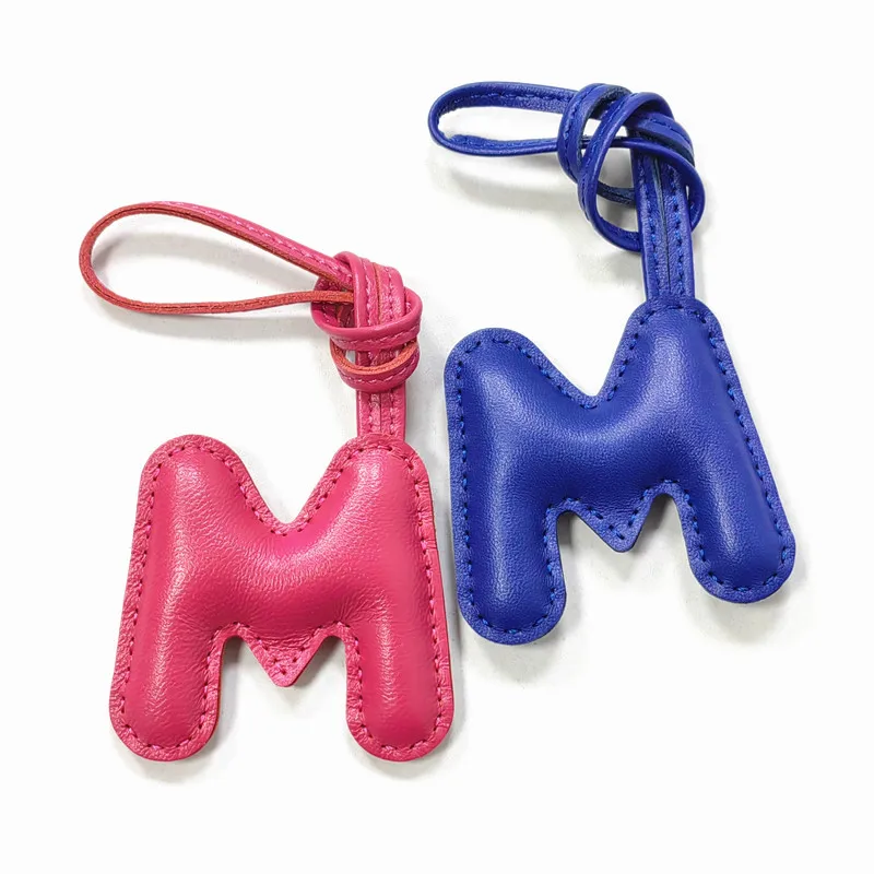 Genuine leather M, letter style decoration, hand sewn, high-end car keychain accessories
Genuine leather M, letter style decoration, hand sewn, high-end car keychain accessories