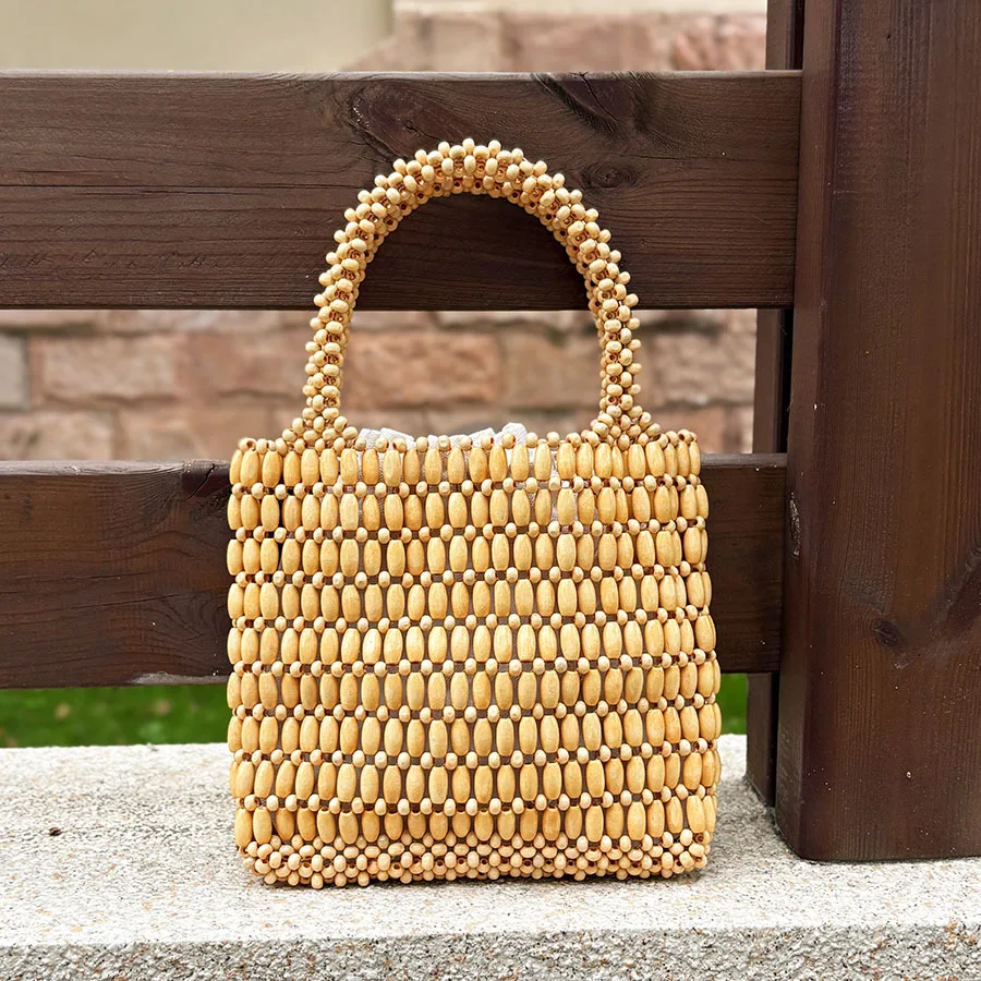 Summer Mori log bead handwoven women's niche design portable commuter high-end leisure bag
Summer Mori log bead handwoven women's niche design portable commuter high-end leisure bag
