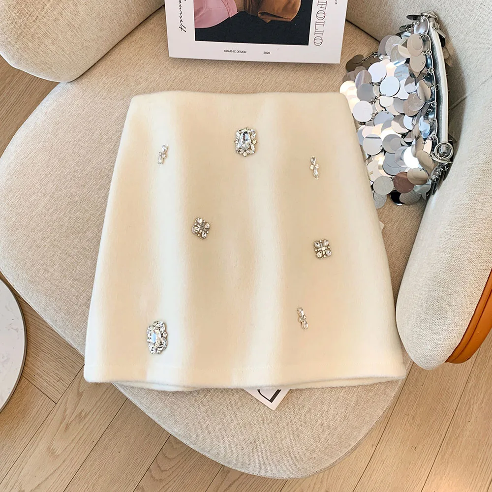 Светло-бежевая шерстяная юбка с ромбовидной аппликацией, женская осенне-зимняя короткая кашемировая юбка трапециевидной формы с высокой талией и запахом бедер
Светло-бежевая шерстяная юбка с ромбовидной аппликацией, женская осенне-зимняя короткая кашемировая юбка трапециевидной формы с высокой талией и запахом бедер