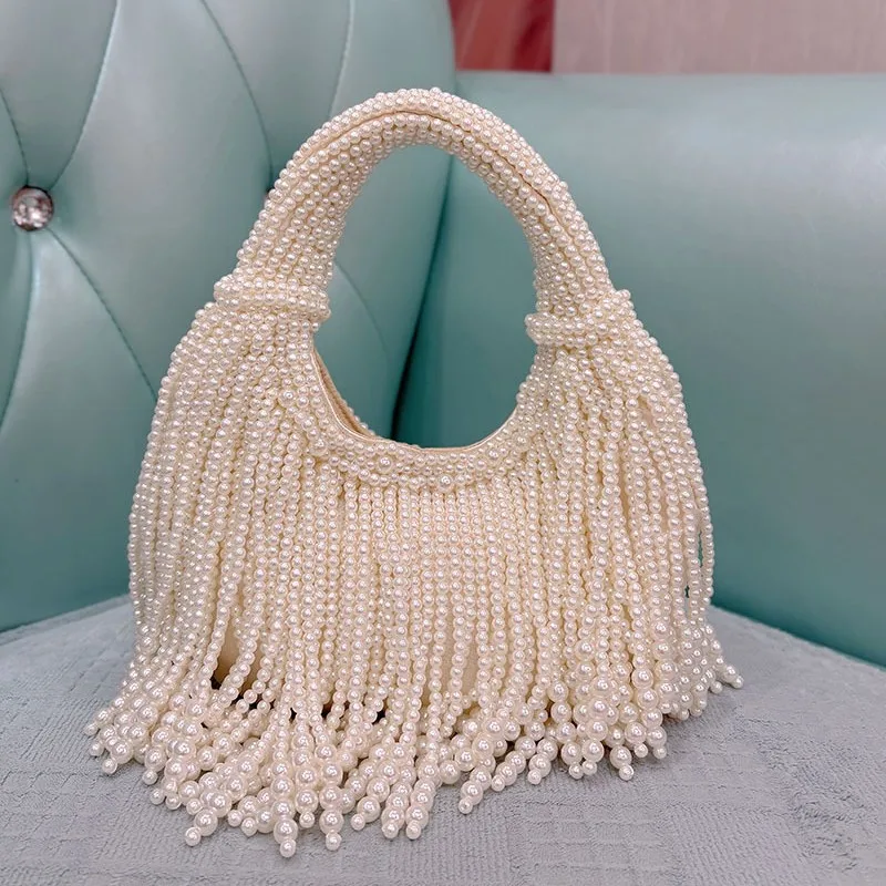 Pearl bag new Chinese banquet hand-woven beaded simple white portable underarm bag
Pearl bag new Chinese banquet hand-woven beaded simple white portable underarm bag