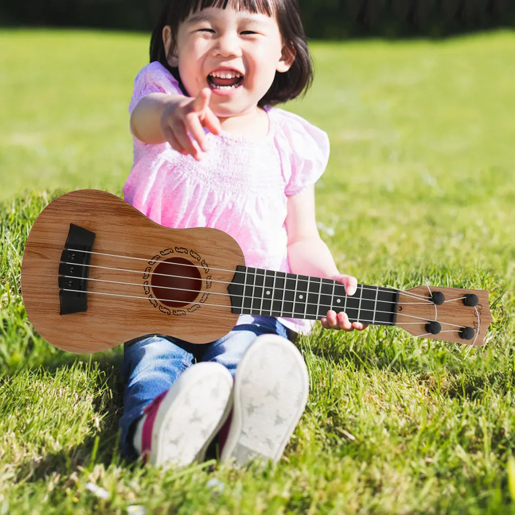2Pcs Ukulele Toy Kids Durable Plastic Portable Musical Instrument Educational Plaything Small Guitar Decor nament
2Pcs Ukulele Toy Kids Durable Plastic Portable Musical Instrument Educational Plaything Small Guitar Decor nament