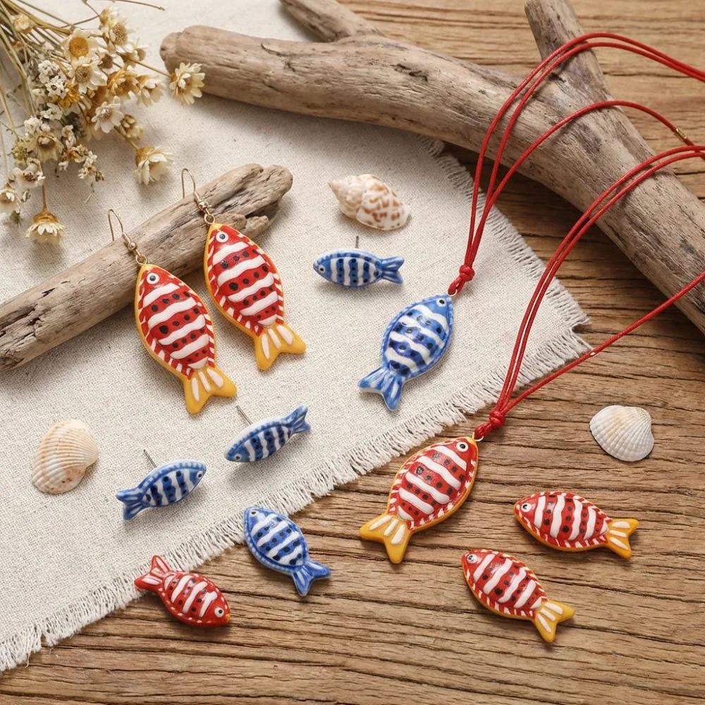 Handmade Ceramic Fish Jewelry Set, Red & Blue Striped Design, Earrings + Necklace + Studs for Summer
Handmade Ceramic Fish Jewelry Set, Red & Blue Striped Design, Earrings + Necklace + Studs for Summer
