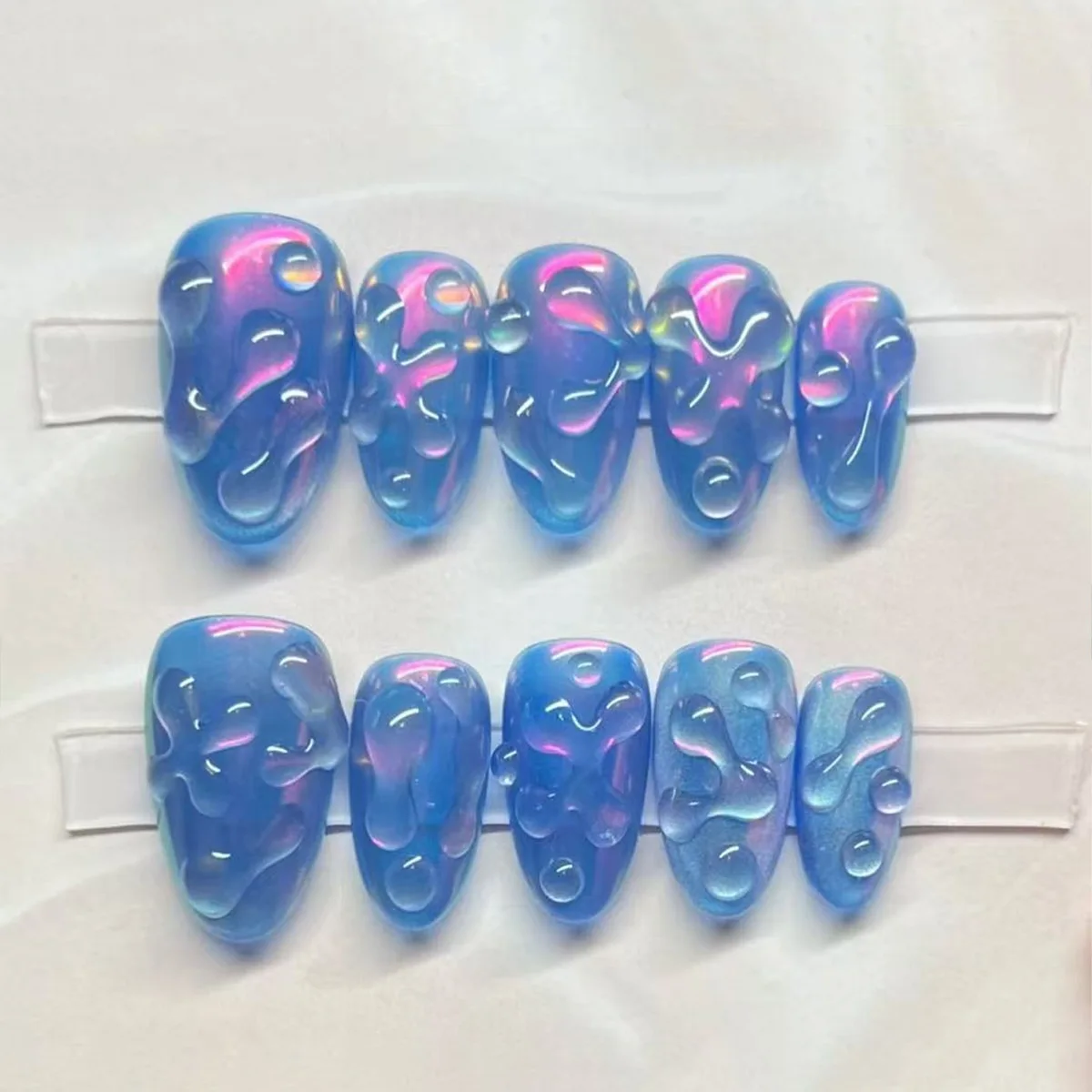 24pcs Cat's Eye False Nails Aurora Blue Short Almond Full Cover Nail Tips Wave Fake Nail Art Reusable Round Head Press on Nails
24pcs Cat's Eye False Nails Aurora Blue Short Almond Full Cover Nail Tips Wave Fake Nail Art Reusable Round Head Press on Nails