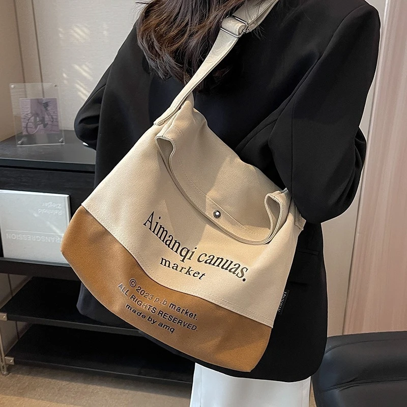 Canvas Bag Women's Large Capacity 2025 New Contrasting Color Shoulder Messenger Bag Commuter Tote Bag
Canvas Bag Women's Large Capacity 2025 New Contrasting Color Shoulder Messenger Bag Commuter Tote Bag