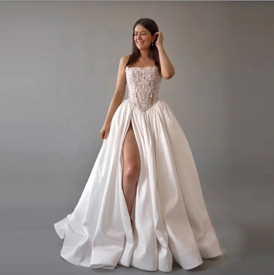 Элегантные белые атласные женские свадебные платья, сексуальные платья трапециевидной формы без рукавов, длина для мытья полов, банкетные платья Vestidos De Novias по индивидуальному заказу
Элегантные белые атласные женские свадебные платья, сексуальные платья трапециевидной формы без рукавов, длина для мытья полов, банкетные платья Vestidos De Novias по индивидуальному заказу