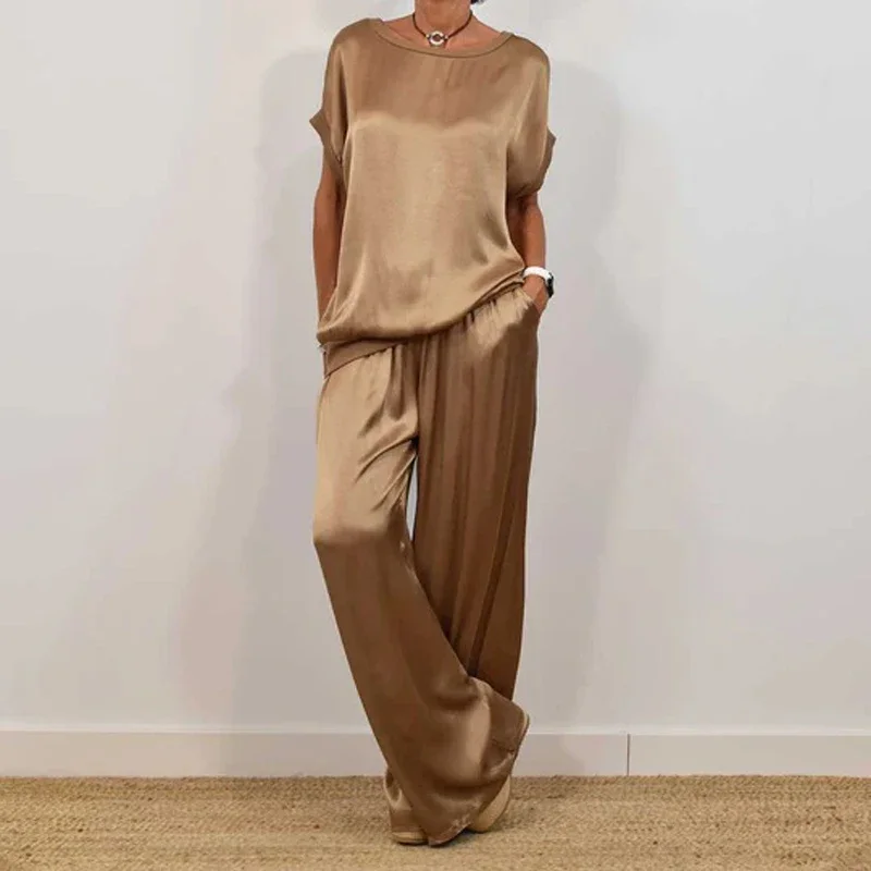 Casual Solid Satin Women's Two Pieces Set 2025 Spring O Neck Short-sleeved Tops & Lace-up Pants Outfits Summer Loose Female Suit
Casual Solid Satin Women's Two Pieces Set 2025 Spring O Neck Short-sleeved Tops & Lace-up Pants Outfits Summer Loose Female Suit