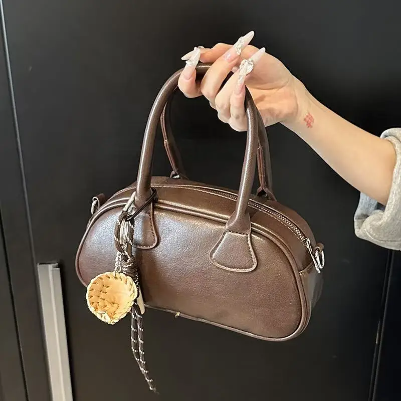 High-end Maillard retro ladies handbag new fashion simple light luxury all-match messenger bag PU portable bowling bag
High-end Maillard retro ladies handbag new fashion simple light luxury all-match messenger bag PU portable bowling bag
