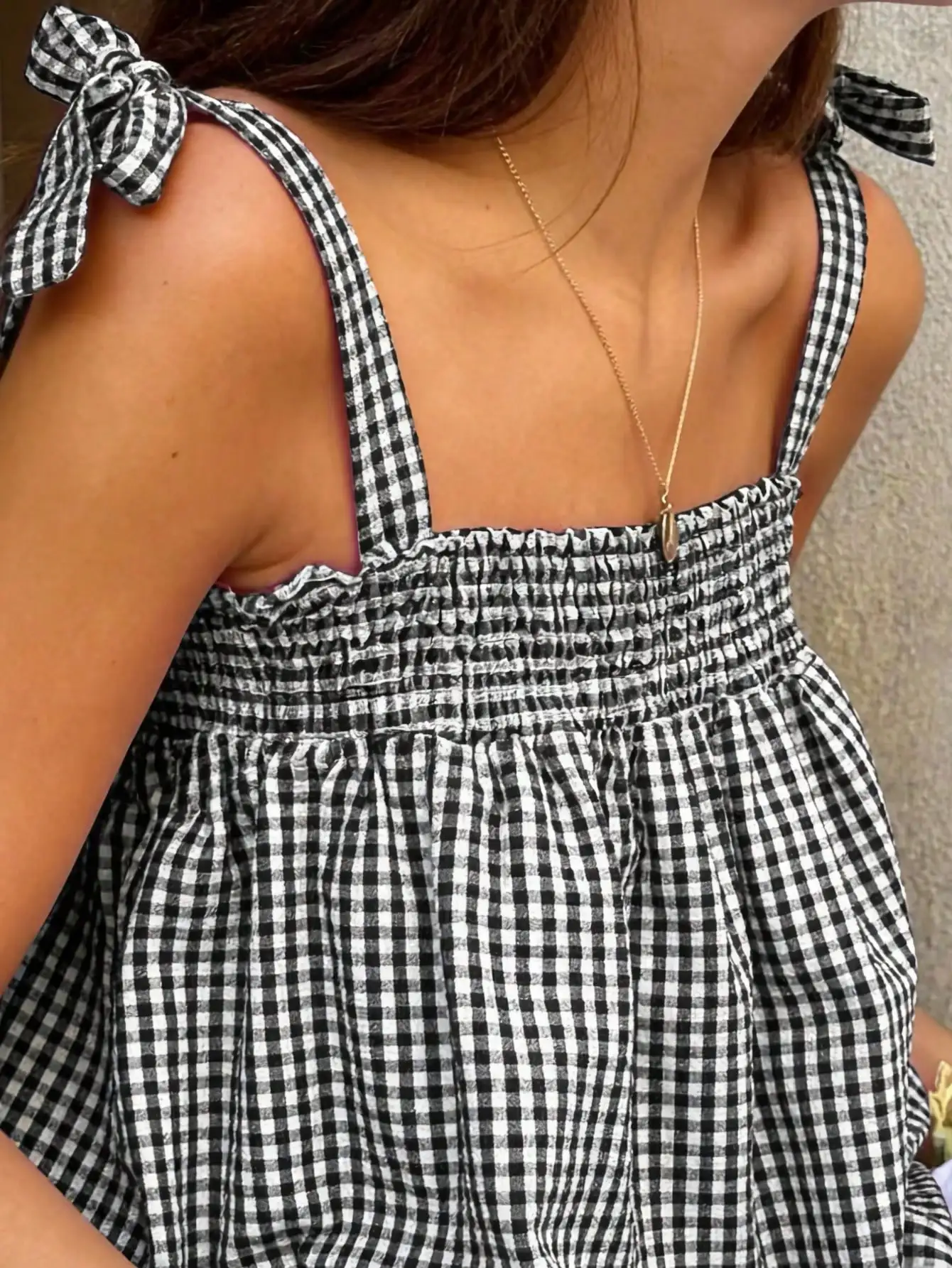Black And White Gingham Smocked Crop Top With Bow Straps
Black And White Gingham Smocked Crop Top With Bow Straps