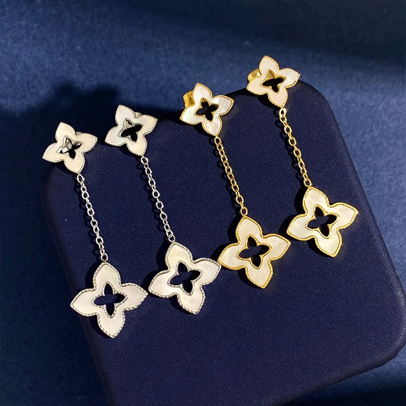 New geometric diamond shaped four leaf flower white shell long earrings with female design sense, size double flower earrings
New geometric diamond shaped four leaf flower white shell long earrings with female design sense, size double flower earrings
