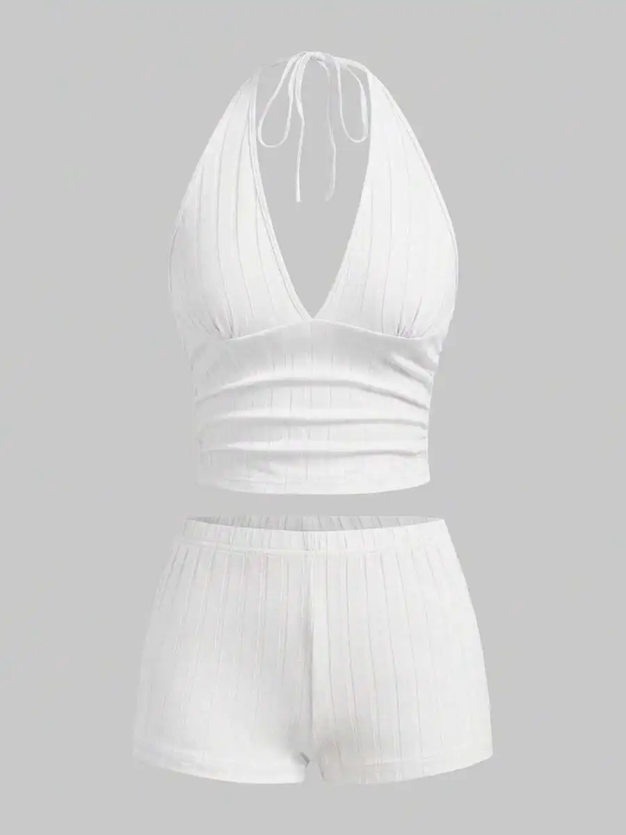 White Ribbed Halter Neck Crop Top Paired With High-Waisted Mini Shorts Two-Piece Set For Casual Beach And Daily Wear
White Ribbed Halter Neck Crop Top Paired With High-Waisted Mini Shorts Two-Piece Set For Casual Beach And Daily Wear