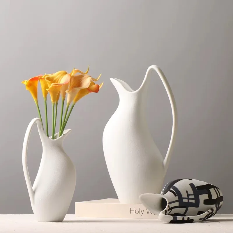 Ceramic vase White kettle shape handle irregular Handmade Flower arrangement handicraft ornaments Home Decoration
Ceramic vase White kettle shape handle irregular Handmade Flower arrangement handicraft ornaments Home Decoration